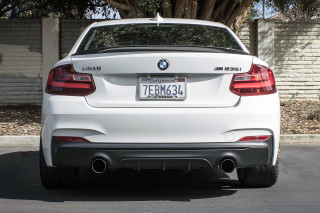 White car parking lot tree 2 - a tree and a building free wallpaper