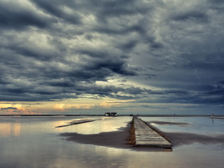 Long wooden dock cloudy sky - top of a beach under a cloudy sky free wallpaper
