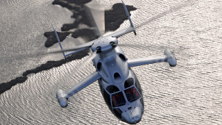 Small white helicopter flying water - a jet engine free wallpaper