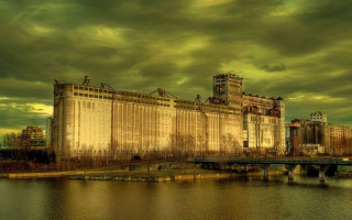 Large building river cloudy sky - a large building free wallpaper