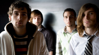 Men group room wall tie - a wall behind them free wallpaper