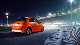 Orange car parked bridge night - an orange car free wallpaper