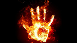 Hand flames black background red 3 - a hand free wallpaper