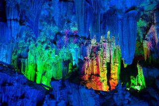 Cave people colorful lights standing - ceiling free wallpaper