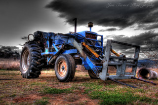 Blue tractor parked field storm - hdr free wallpaper