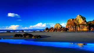 Beach blue water rocks blue - a blue water free wallpaper