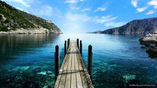 Pier mountains blue water sun - blue water free wallpaper