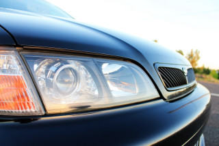 Car headlight closeup road sky - a sky background and trees free wallpaper