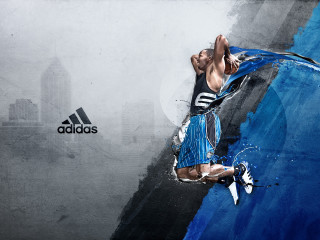 Man jumping basketball city background - a basketball free wallpaper for desktop