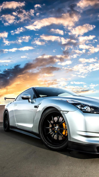 Silver sports car cloudy sky 10 - dawn free wallpaper for mobile