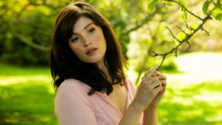 Woman pink shirt holding branch 2 - clarice beckett free wallpaper