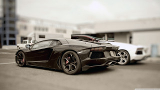 Black sports car parking lot 39 - a white car free wallpaper