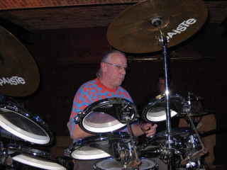 Man playing drums brick wall - a man playing free wallpaper