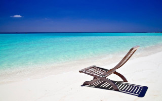 Chair beach ocean blue sky - a beach next free wallpaper