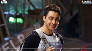 Man backpack smiling camera green - in the foreground free wallpaper