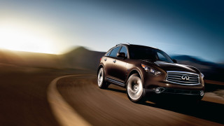 Brown car driving mountain range - a brown car free wallpaper