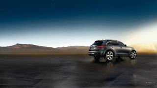 Black car desert road mountains 2 - a bright sun free wallpaper