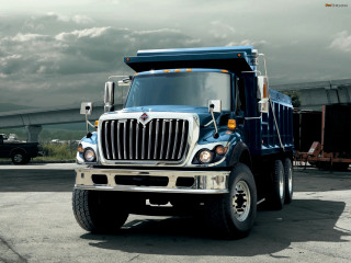 Dump truck parking lot cloudy - a cloudy sky in the background free wallpaper for desktop