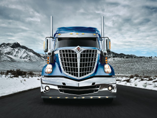 Blue semi truck driving road - evelyn abelson free wallpaper