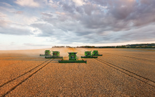 Green farm equipment wheat field - cloud above free wallpaper