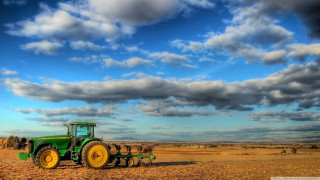 Tractor field cloudy sky people - a tractor free wallpaper