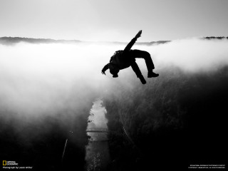 Man jumping off cliff arms - figuration libre free wallpaper