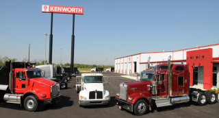 Semi trucks parked storefront kenworth - turnaround free wallpaper
