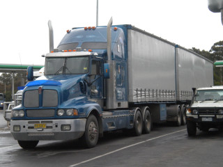 Semi truck street white truck - front view free wallpaper