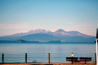 Person sitting bench lake mountains - a bench in front free wallpaper