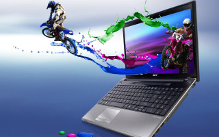 Laptop colorful motorcyclist image background - a laptop computer free wallpaper for desktop
