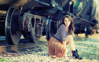 Woman sitting ground train car - the track free wallpaper