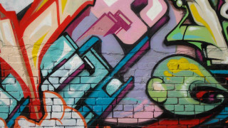 Graffiti wall clock brick side - side wall free wallpaper