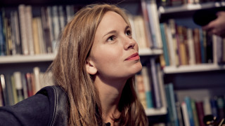 Woman looking up book shelf - anna haifisch free wallpaper