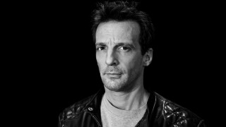 Man leather jacket serious look 6 - studio portrait free wallpaper