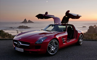 Red sports car ocean sunset - the sun setting free wallpaper