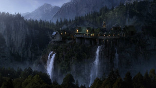 Castle cliff waterfall night lights 2 - a waterfall in the background free wallpaper