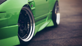 Green car chrome rims street - a black floor free wallpaper