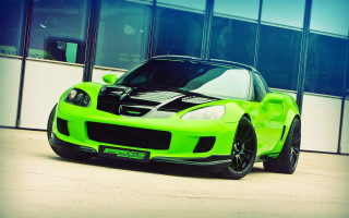 Green sports car city building - a green sports car free wallpaper