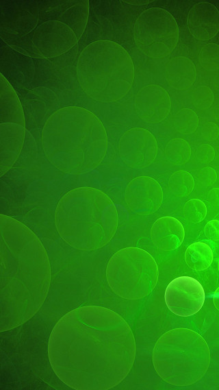 Green background bubbles water surface - a green light in the middle free wallpaper
