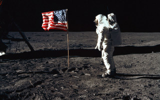 Astronaut standing moon flag surface 2 - the moon next free wallpaper
