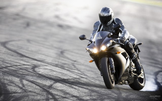Person riding motorcycle track helmet 4 - motion blur free wallpaper