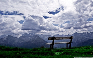 Bench hillside cloudy sky mountains - a bench free wallpaper