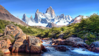 Mountain range river snowy peaks 3 - a mountain range in the background free wallpaper