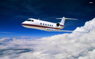 Small plane blue sky clouds - a blue sky background free wallpaper