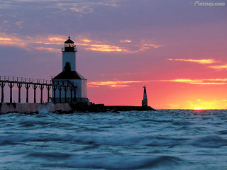 Lighthouse pier sunset background water - a sunset in the background and a body of water free wallpaper