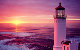 Lighthouse sunset water pink sky - rim light free wallpaper