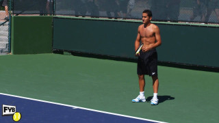 Man standing tennis court holding - his hand and a ball free wallpaper