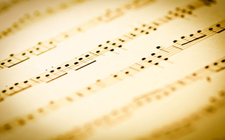 Music sheet notations clock top - a blurry background free wallpaper