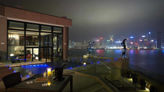 Balcony city night water buildings - a balcony free wallpaper