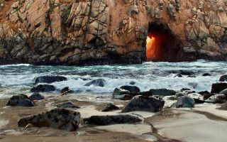 Cave entrance red light ocean - rim light free wallpaper